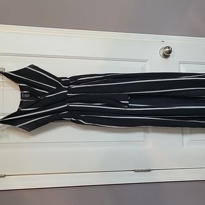 Size small, lightweight romper with a long skirt overlay and a tie waist